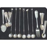 A set of 6 white metal oriental spoons with flower heads to the bowls, bamboo body and different