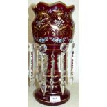 A 19th century gilt decorated and enamelled ruby glass lustre, with cut glass drops, 14"