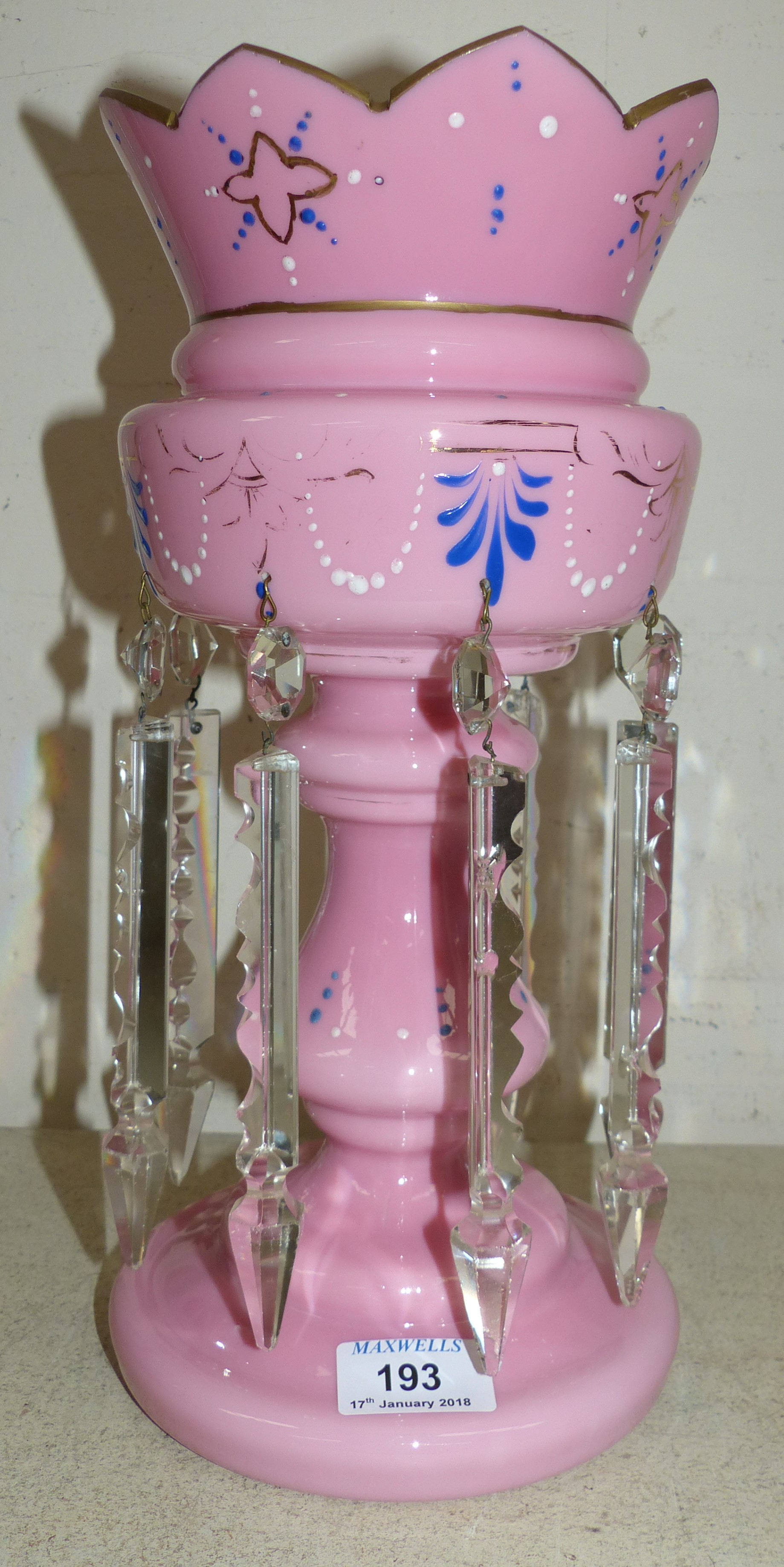A 19th century gilt decorated and enamelled pink overlaid glass lustre, with cut glass drops, 14"