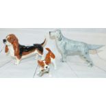 A Beswick china figure of a Basset Hound, a similar figure Bayldone Baronet (tail repaired), another