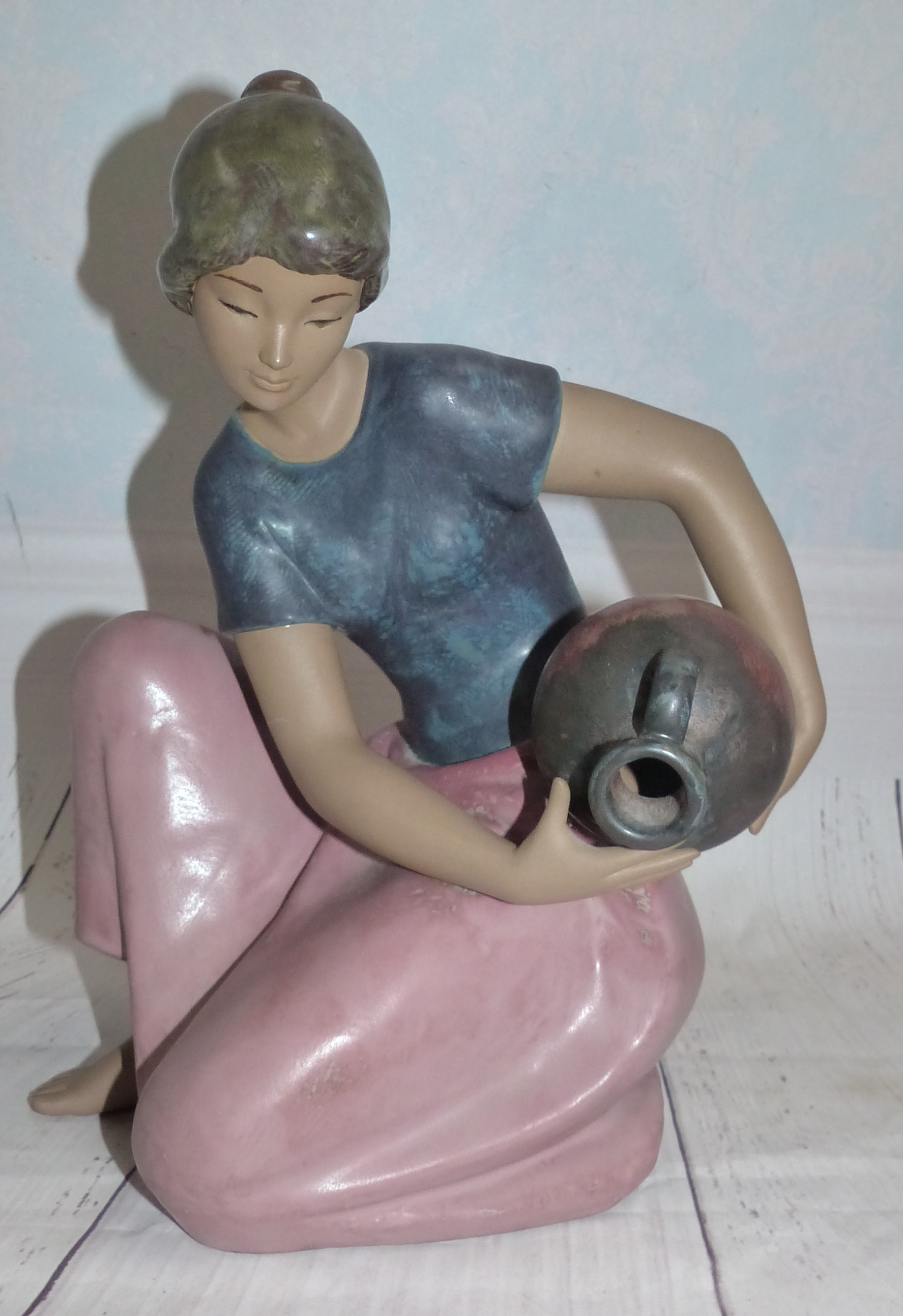 A Lladro figure - Young Woman Kneeling with Waterpot height 111/2''