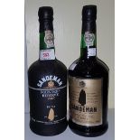 A bottle of Sandeman Founder's Reserve Port and another bottle of Sandeman Port