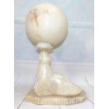 An Alabaster table lamp in the form of a seal