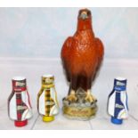 A Beswick ''Golden Eagle'' decanter; 3 McGibbons minatures in the form of golf bag all with