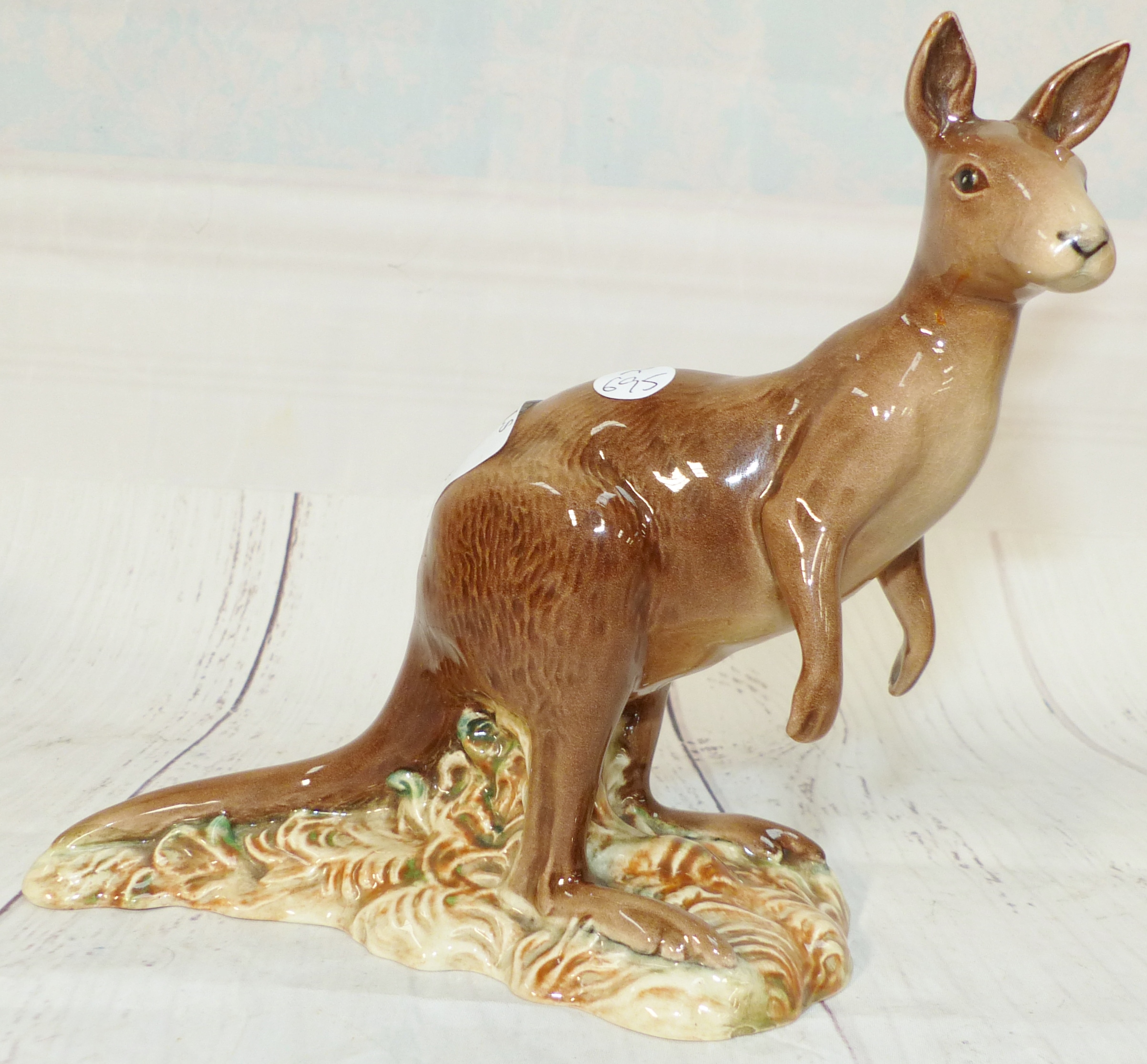 A Beswick pottery figure of a Kangaroo 6'' high (ear broken and reattached)