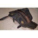 A 19th Century leather and wood pit pony saddle saddle with stud work