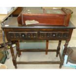 A stained wood two drawer hall table and a 8 day wall clock