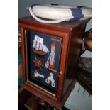 Reproduction dwarf nautical cabinet; a similar life ring/clock; 3 nautical wall plaques; toy cannon