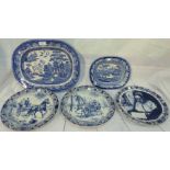 A 19th century stoneware Willow Pattern meat plate, a similar smaller plate and 3 Delft wall plates;
