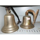 2 brass ships bells on steel and brass wall brackets respectively height 9'' & 101/2''