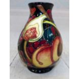 Moorcroft - vase decorated with figs and other fruit on dark background hand painted marks to base