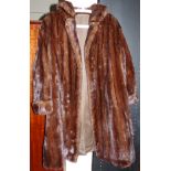 A full length dark brown mink coat