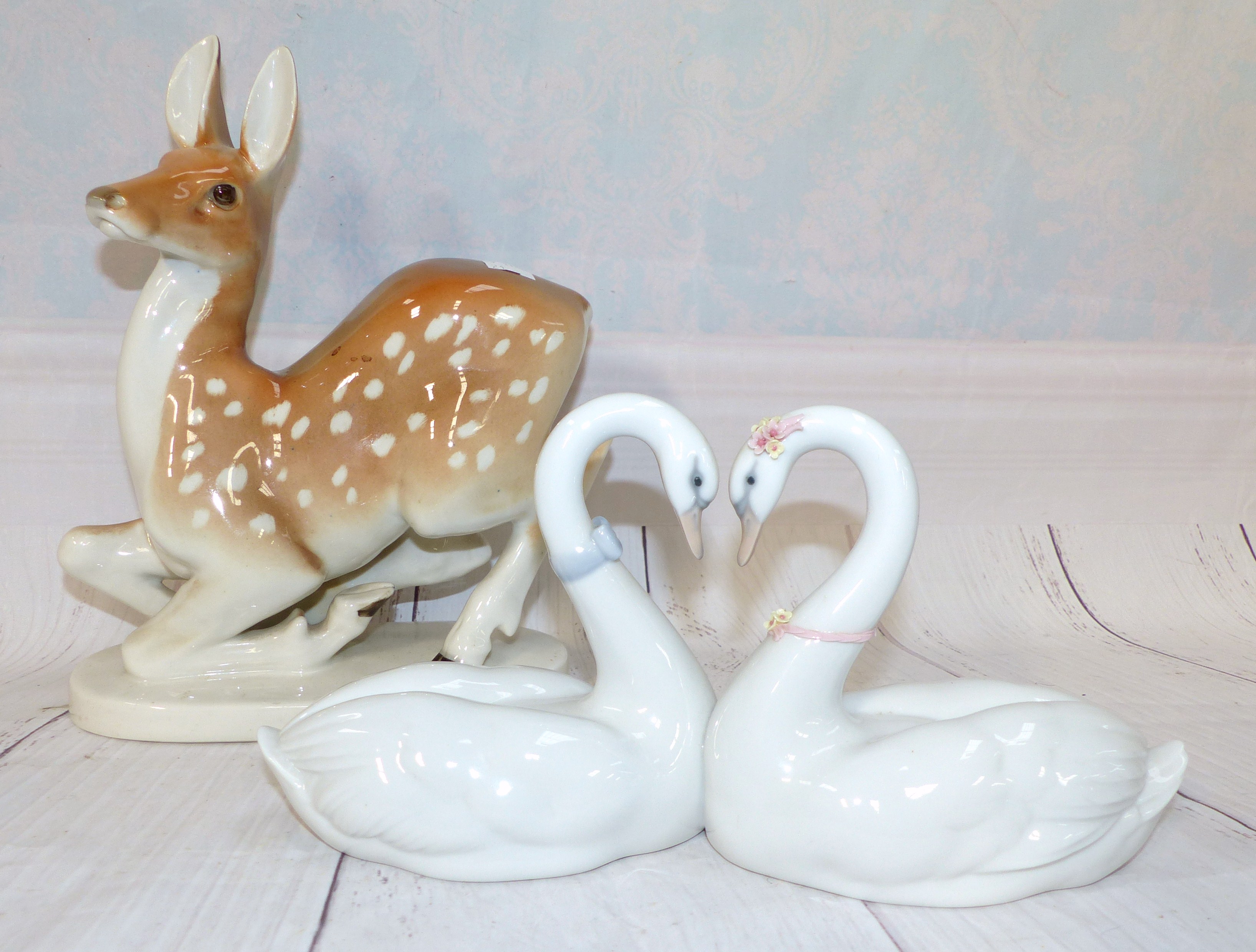 A Lladro group of 2 swans; a USSR figure of a Fallow Deer