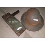 A Zuckerman civil defence helmet and air raid warden's rattle