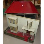 A painted wood dolls house