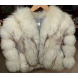 A white fox fur jacket