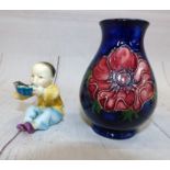 A small Moorcroft baluster vase decorated with anemones against a blue ground, a Royal Worcester