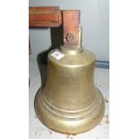 A large brass ship's bell on steel wall bracket height 11'' impressed GVI R