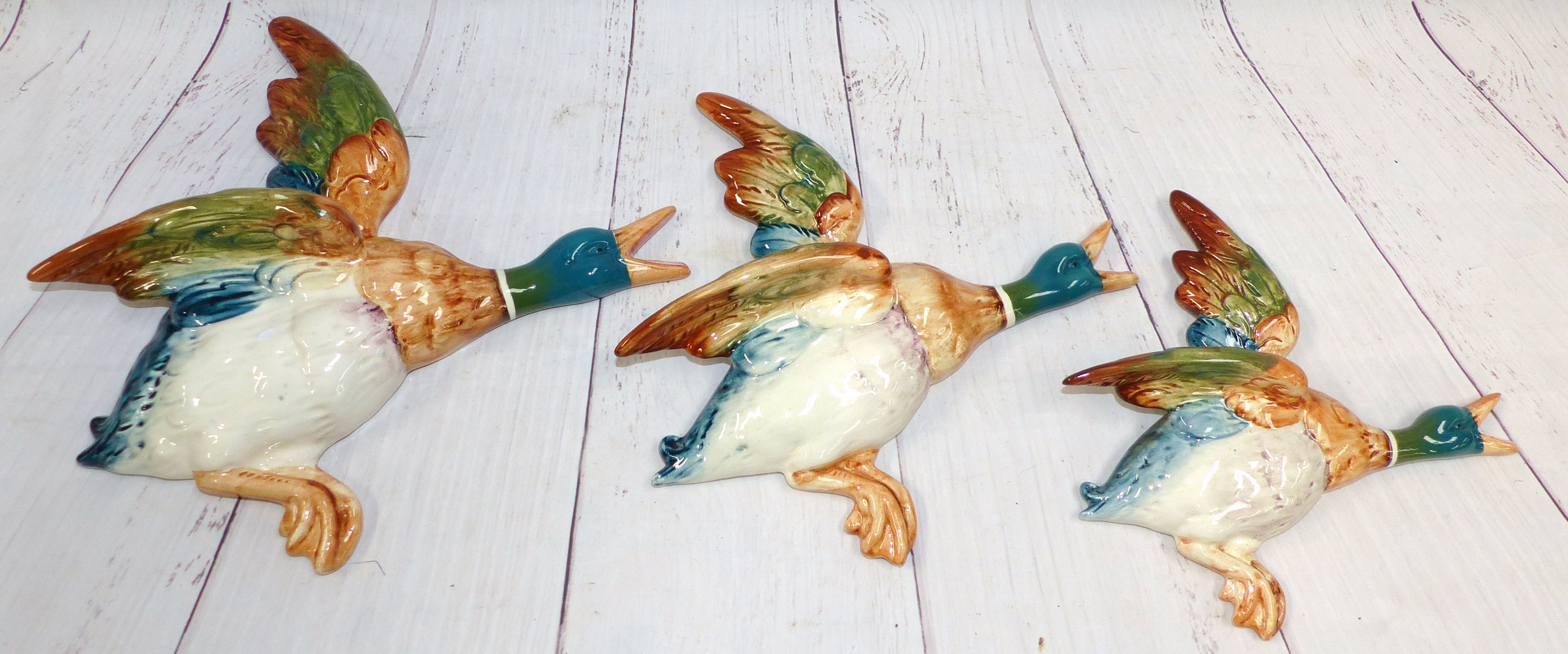 A set of three graduating Beswick wall ducks (smallest wing is repaired)