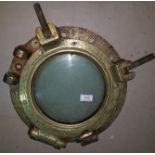 Hinged brass porthole with 3 threaded fasteners 1 with butterfly nut impressed 404 No. 5 overall