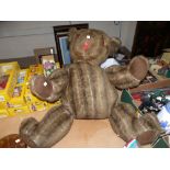 A large brown felt padded Teddy Bear with glass eyes height 25''