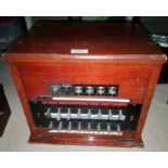 A pre-war GPO telephone exchange module, in mahogany case
