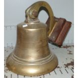 A large brass ships bell on wall bracket height 11''