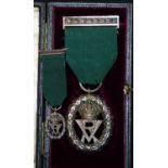 A QV Volunteer Officer's Decoration with miniature in original case, the back of the medal