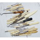 A collection of 28 19th Century bone and Ivory handled button hooks