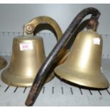 A ships bell lettered ''Winkworth'' on steel bracket height 71/2'', a ships bell on brass wall