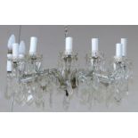 A large Victorian style glass chandelier, 12 branches with cut faceted drops (1 drip tray missing)