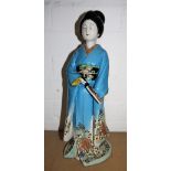 A porcelain figure of a lady dressed in kimono, height 14½"