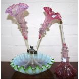 A Victorian glass epergne with circular folded green and opaque white vase, 3 cranberry flutes