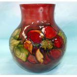 A Moorcroft squat bulbous vase with flambé clematis decoration, impressed and signed in blue, with