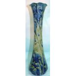 A James MacIntyre & Co Florian vase of slender waisted form with folded rim, in blue and green,