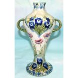 A William Moorcroft "Florian" vase of 2 handled inverted baluster form with short neck and flared