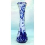 A James MacIntyre blue Florian vase of slender waisted form with folded rim, decorated with poppies,