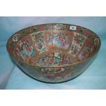 A Chinese Canton "famille verte" large punch bowl decorated with reserve panels of interior scenes