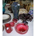 Four pieces of cranberry glass; Victorian coloured glass