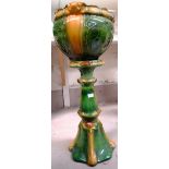 An Art Nouveau green glaze jardiniere and stand