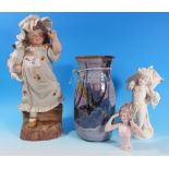 A Victorian bisque figure: "Millie", height 14"; a cherub posy vase; a Canterbury studio pottery