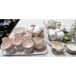 A Susie Cooper pink floral part tea set, C984, 38 pieces approx; 2 Susie Cooper part coffee sets