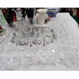 A selection of cut and other drinking glasses; decanters; etc.