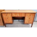 A 1960's teak kneehole desk by Vanson with 1 central and 6 kneehole drawers