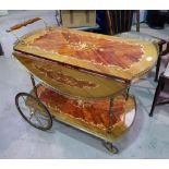 A 1950's Italian style inlaid drinks trolley; a similar standard lamp