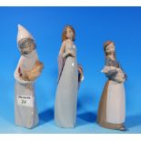 A Lladro figure of a girl in evening gown, 8"; 2 others