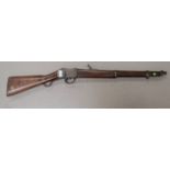 A Mark II Martini Henry carbine converted from full service length, walnut stock (some small