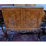 A reproduction burr walnut side cabinet