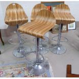 Four rise and fall bar chairs in chrome and wood