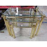 A nest of 3 modern glass and gilt tables